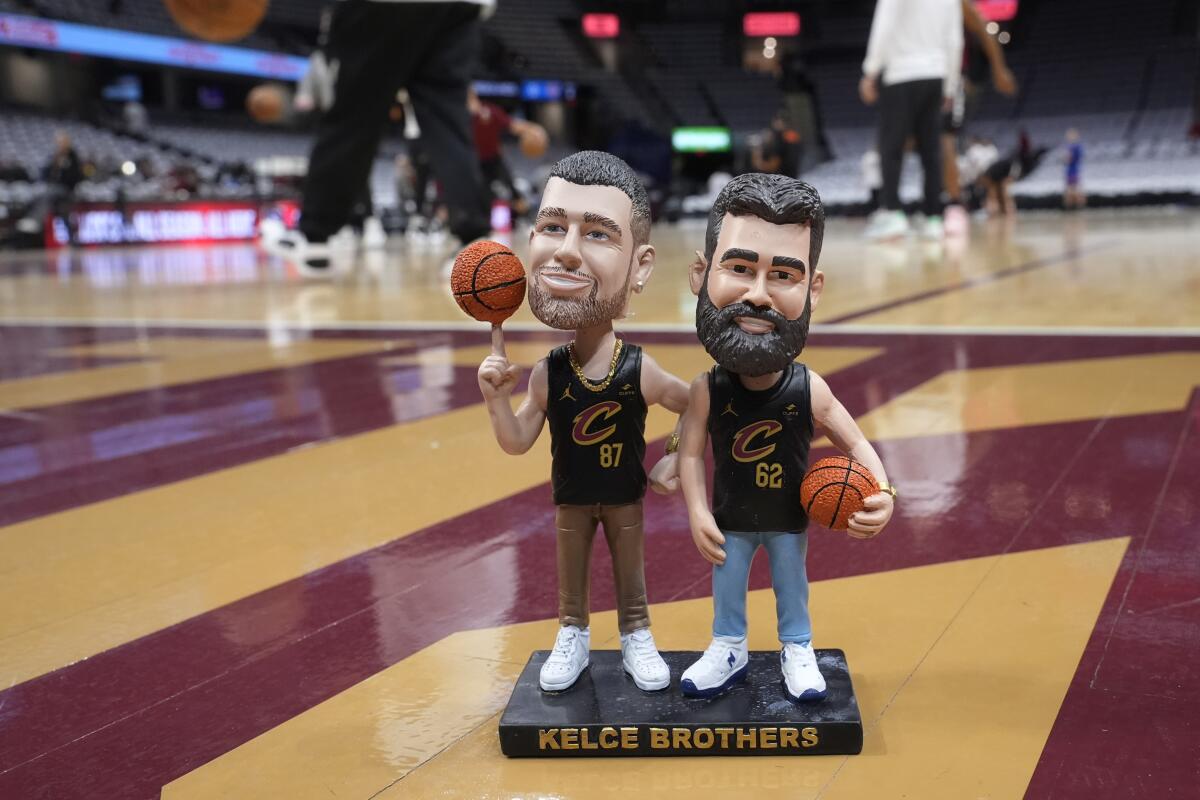 Brothers Travis and Jason Kelce honored with bobblehead giveaway at Cavs game